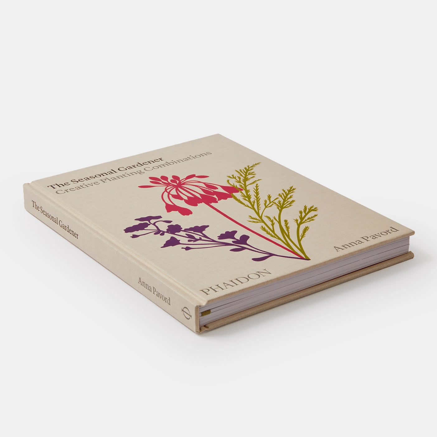  A close-up of The Seasonal Gardener book featuring vibrant plants and gardening tools