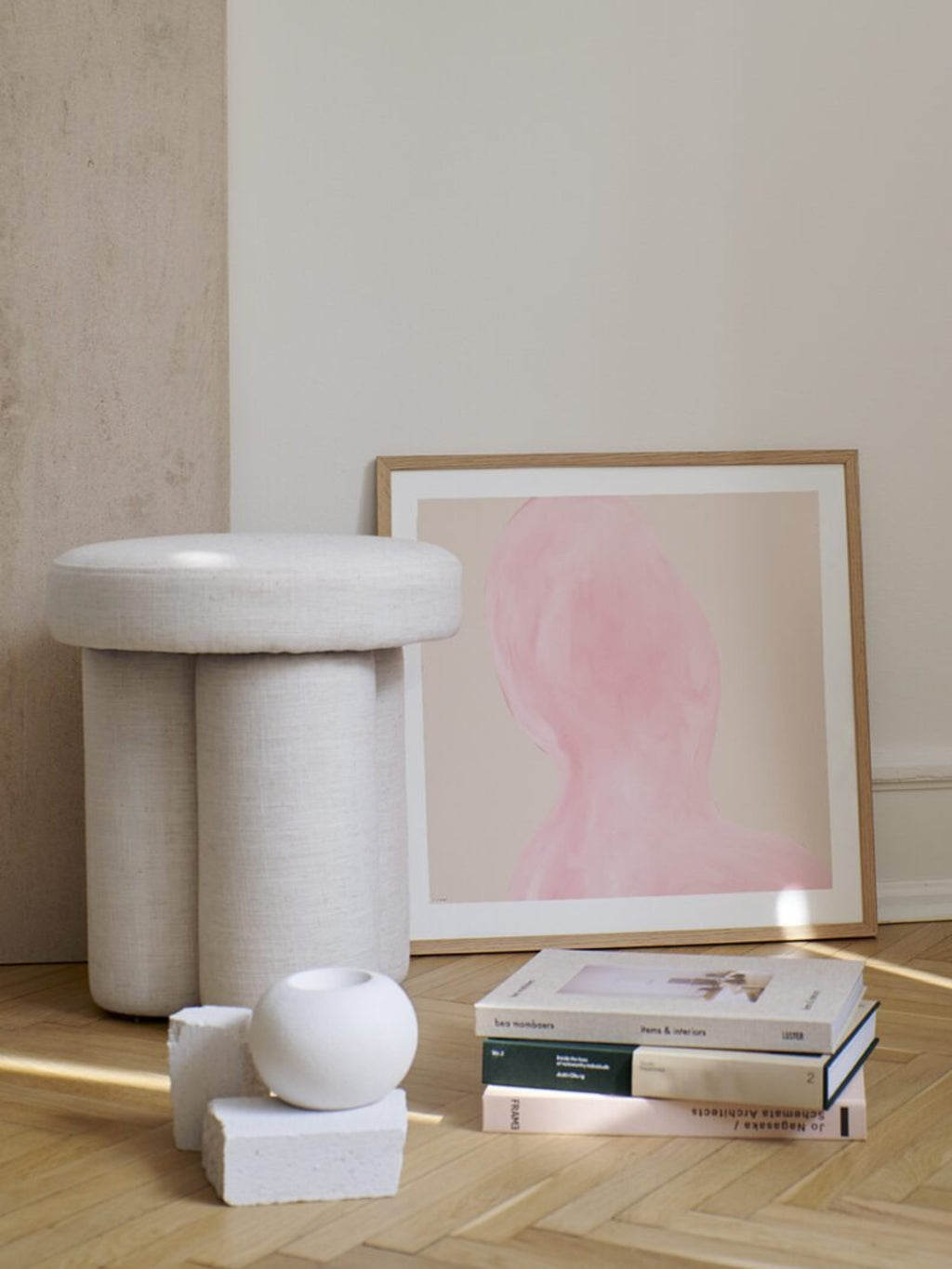 The Poster Club Abstraction, a minimalist abstract art print featuring a muted pink human-like silhouette against a soft beige background. It is presented in a natural oak frame with a crisp white mat. Perfect as contemporary wall art for organic modern living rooms, minimalist bedrooms, or stylish gallery walls.