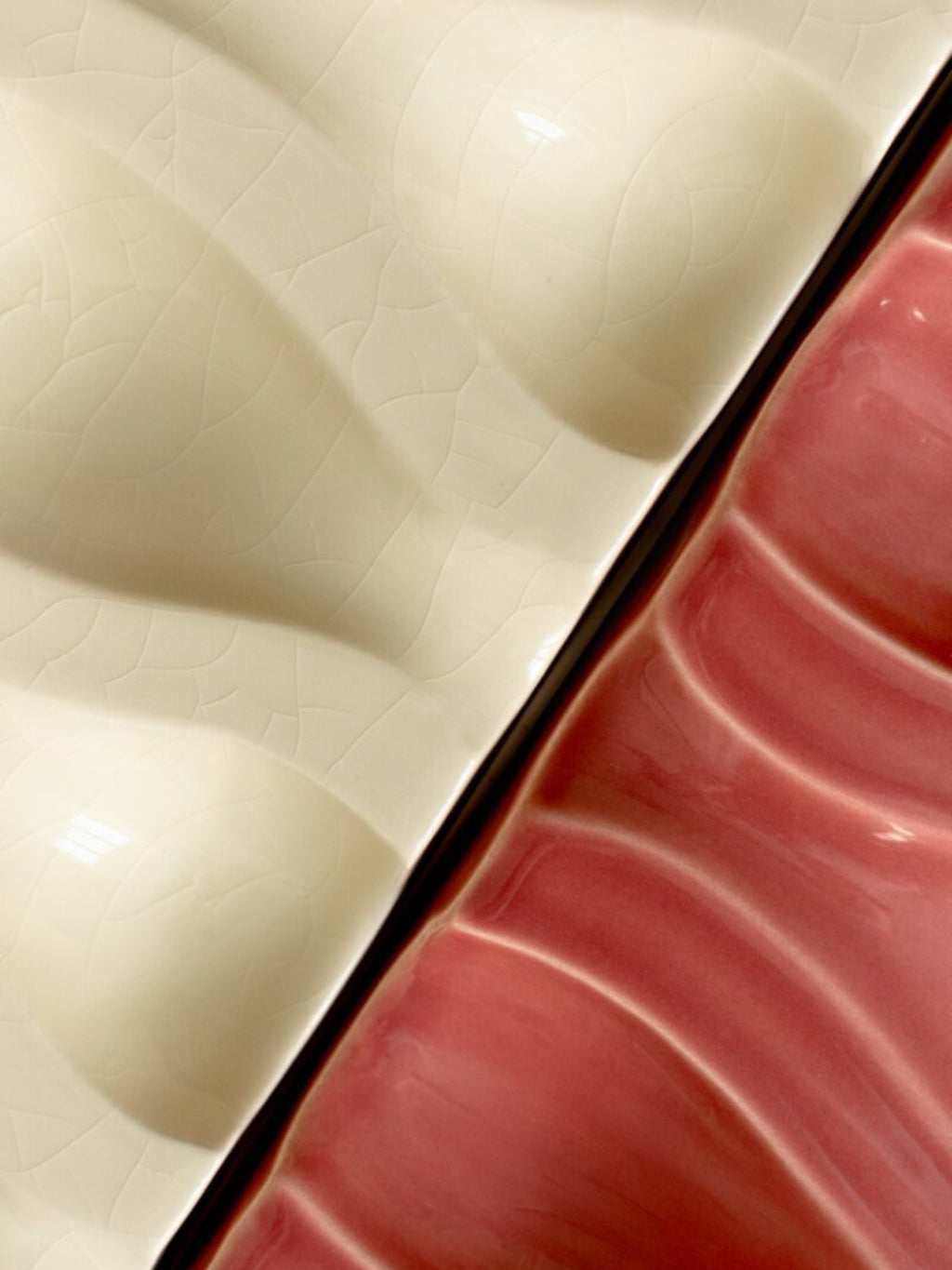 The Poster Club Echo Relief No. 02, an abstract art print showcasing a contemporary sculptural relief with a striking diagonal division of textures and colors. One half features a cream crackle glaze ceramic texture, while the other displays a dusty rose pink glossy surface with undulating wavy ridges. This minimalist wall art is perfect for adding organic modern elegance to living rooms, bedrooms, or gallery walls.