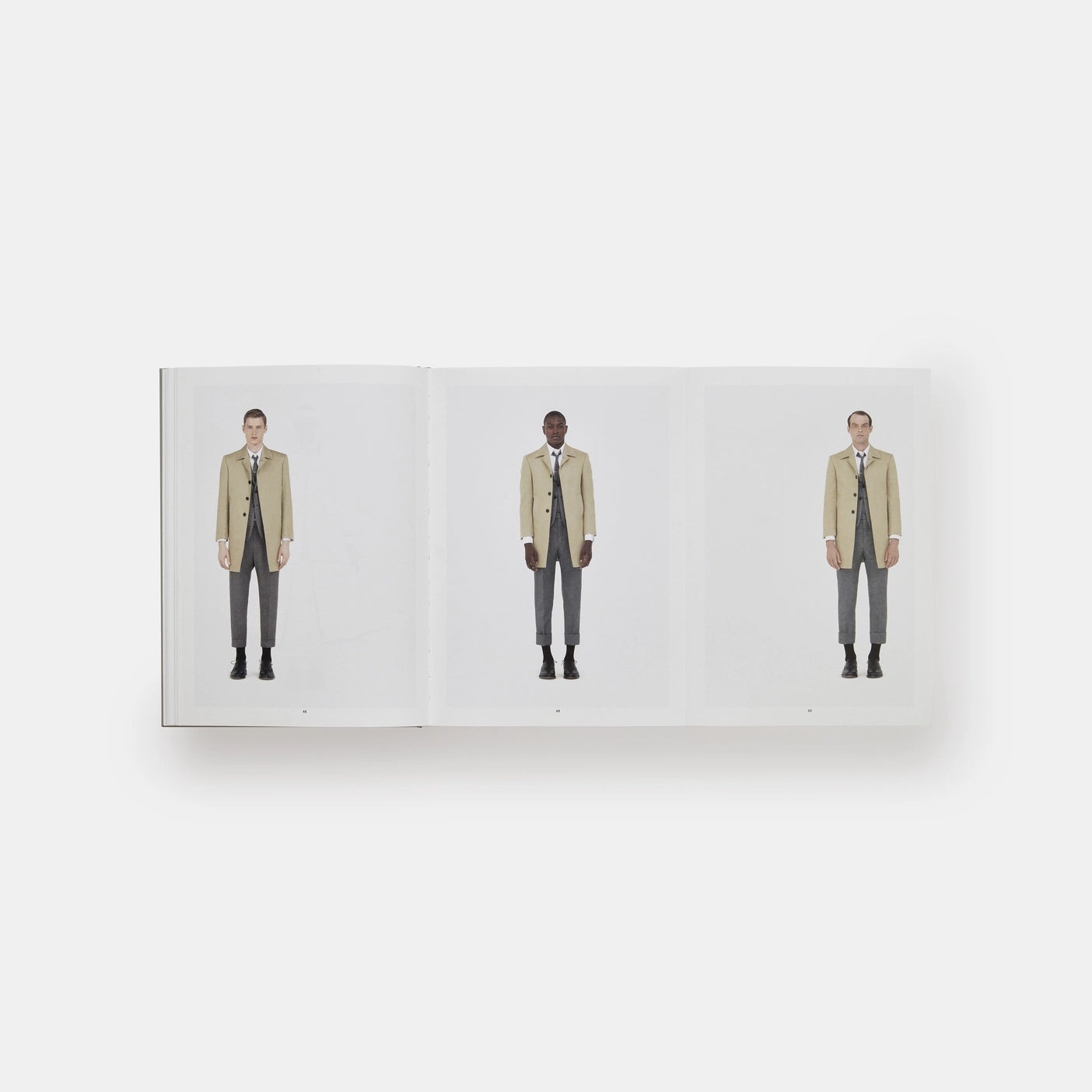 A close-up image of the Thom Browne men's slim-fit wool blazer with signature tricolor stripes and notch lapel