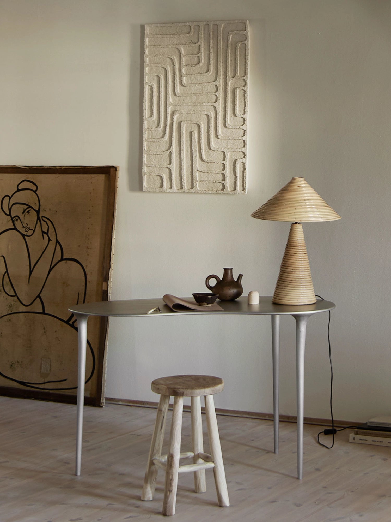 Tine K Dune Recycled Aluminium Desk, a modern minimalist desk crafted from sleek, matte silver recycled aluminium, featuring a gracefully curved oval tabletop and elegant tapered legs. This contemporary oval desk offers a refined, sustainable design for a home office, entryway, or stylish living room.