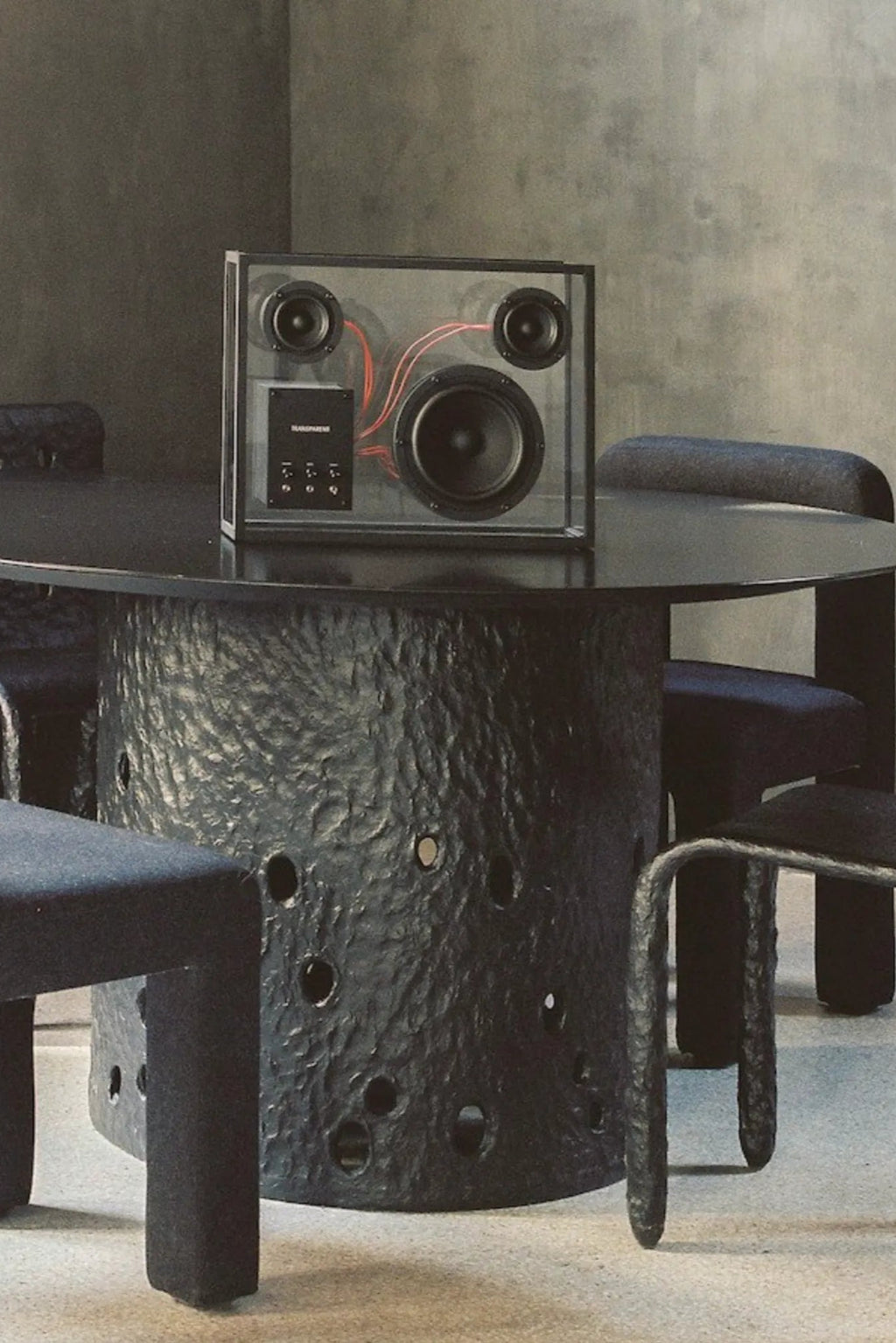 A close-up of the transparent speaker showing the internal components