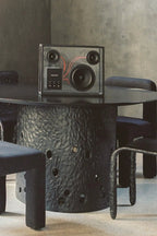 A close-up of the transparent speaker showing the internal components