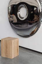 Coi Wood Pillar candle holder with a sturdy base for stability and durability