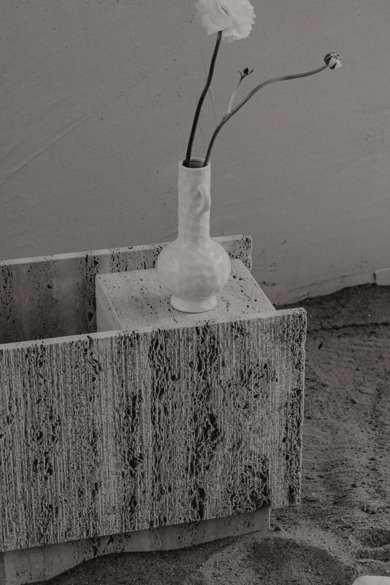 Lido Flower Stand in a bright and airy room, adding a touch of nature with fresh blooms and greenery on its shelves