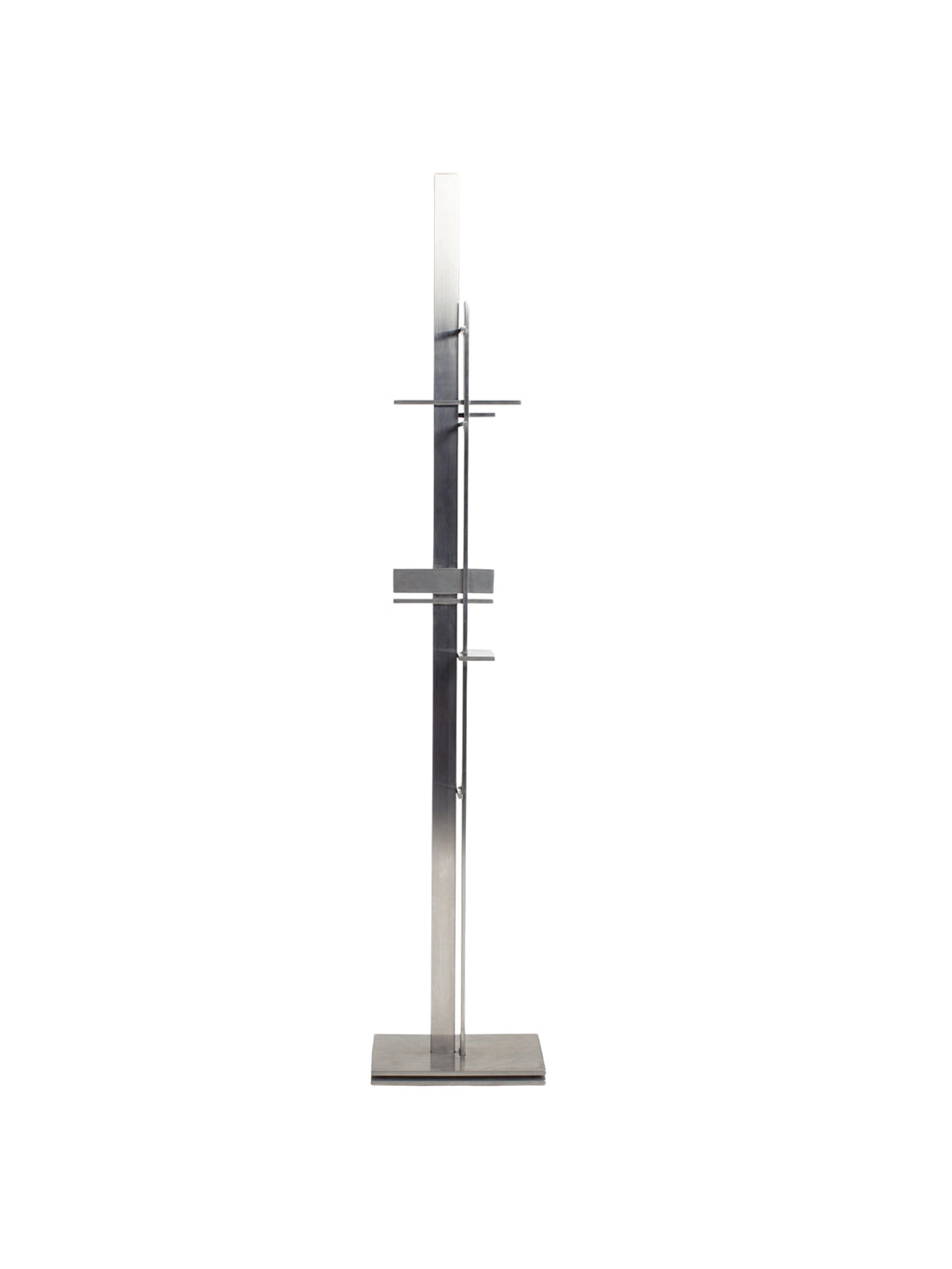 YET. Dash Hanger, a striking modern minimalist garment rack constructed from brushed stainless steel, featuring a tall, slender rectangular post with multiple staggered horizontal bars for hanging.