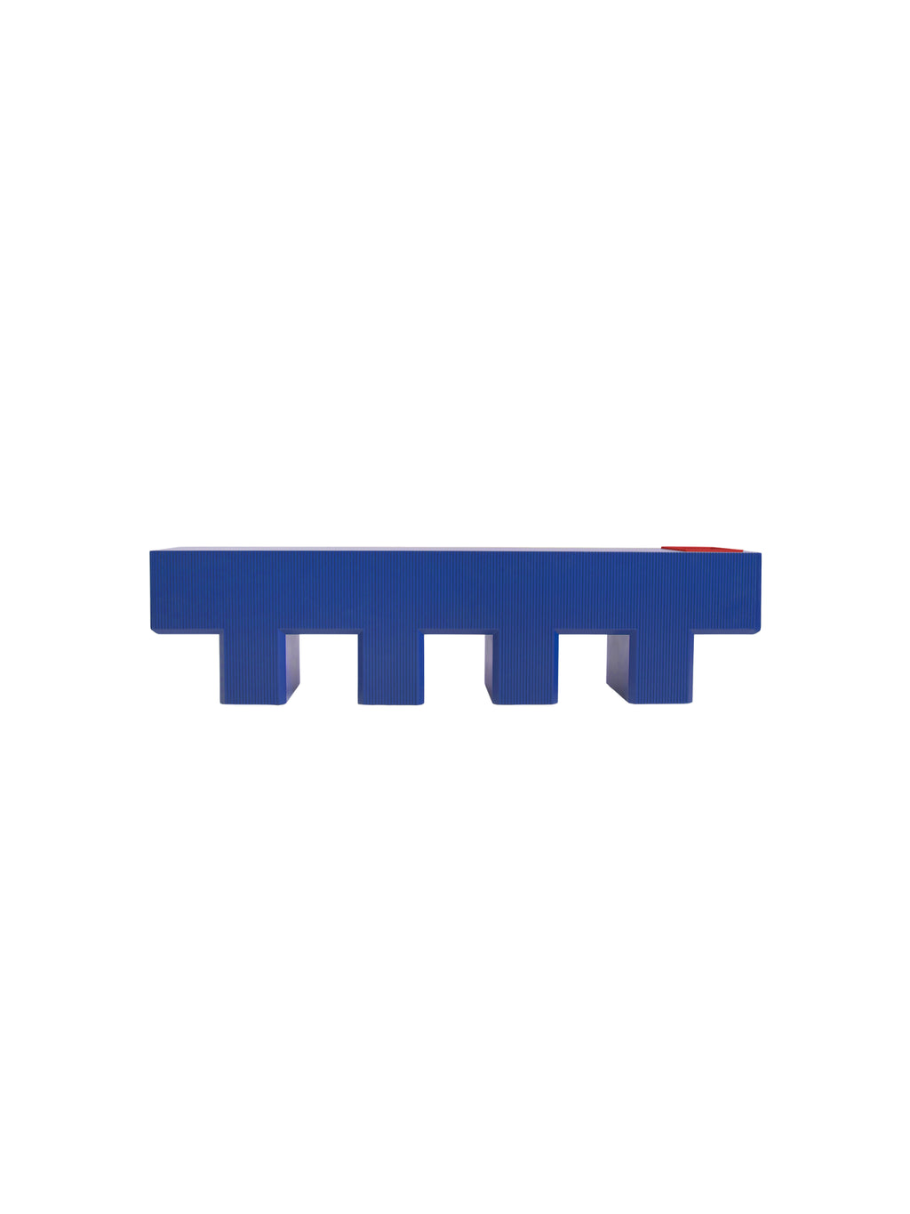 YET. Lego Bench, a striking contemporary bench featuring a vibrant royal blue lacquered finish with a distinctive ribbed texture on its long sides and a smooth top surface.
